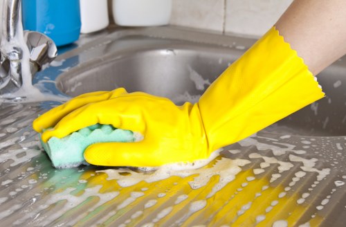Detail cleaning of bathroom surfaces during a move-in clean in Bromley